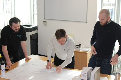 ATS Design Engineers evaluating project warehouse plan 