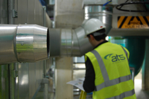 Service-Maintenance2 High velocity ductwork nozzle next to ATS installer with high vis