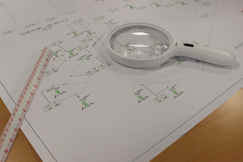 ats-design-plan ATS schematic drawing with magnifying glass